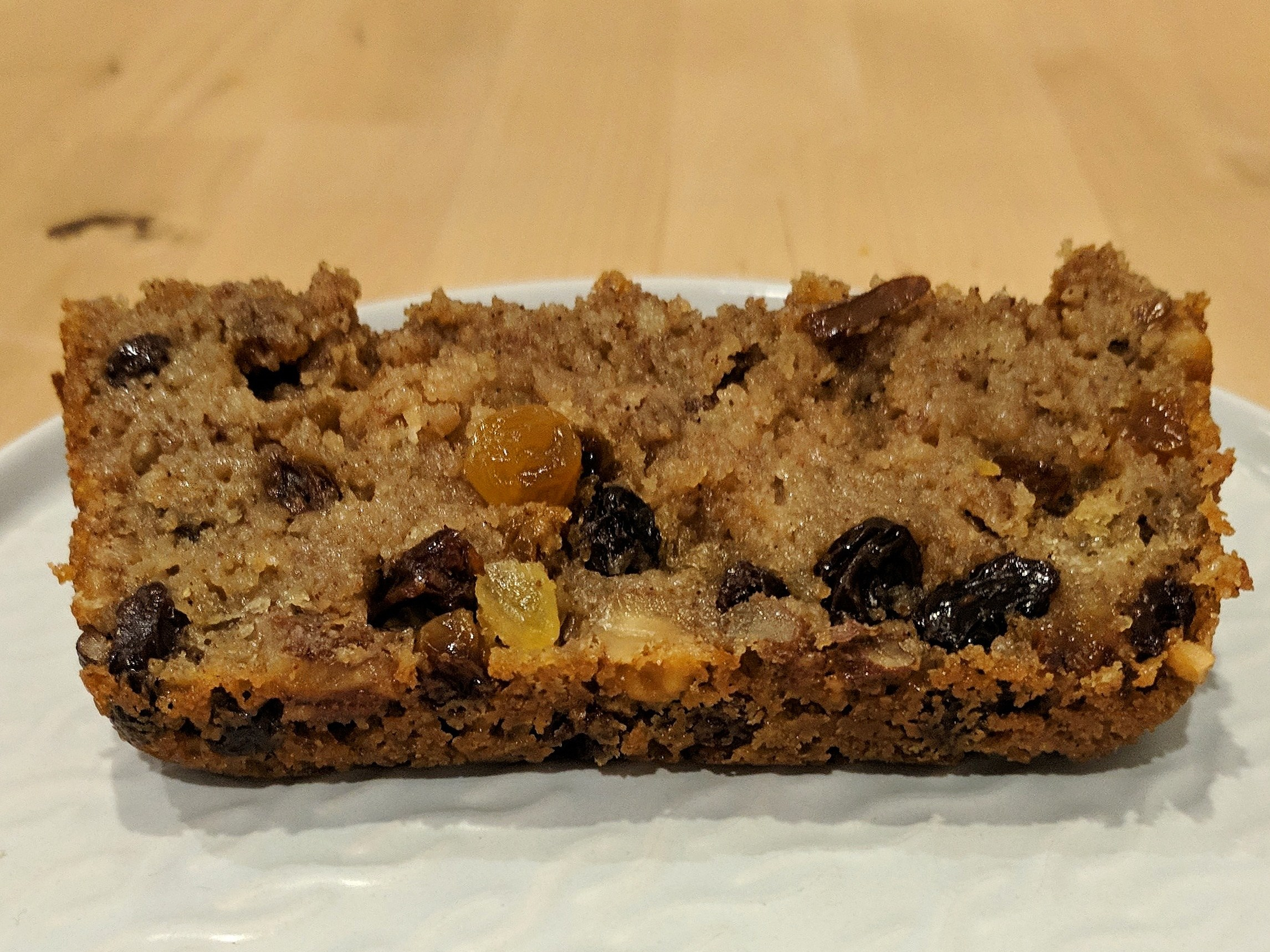 Slice of rather squishy cake, with raisins