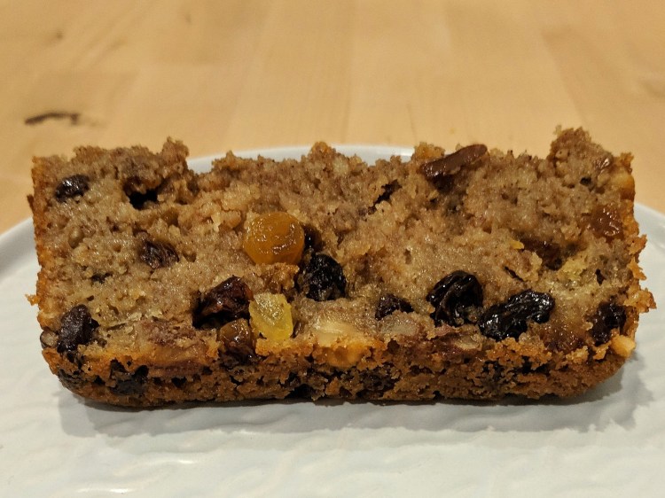 Slice of rather squishy cake, with raisins