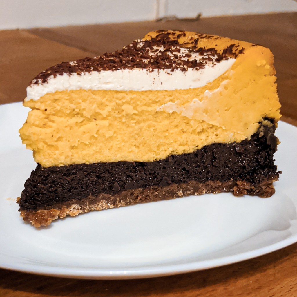 Slice of pumpkin chocolate cheesecake
